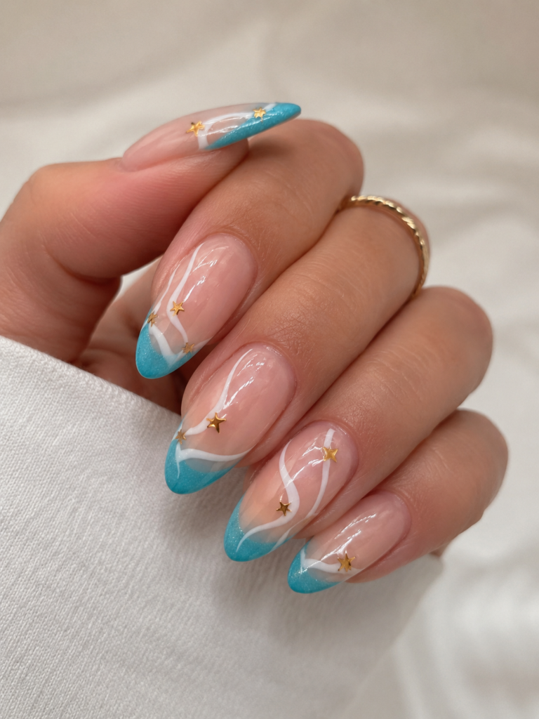 turquoise coastal French tip nails with gold stars