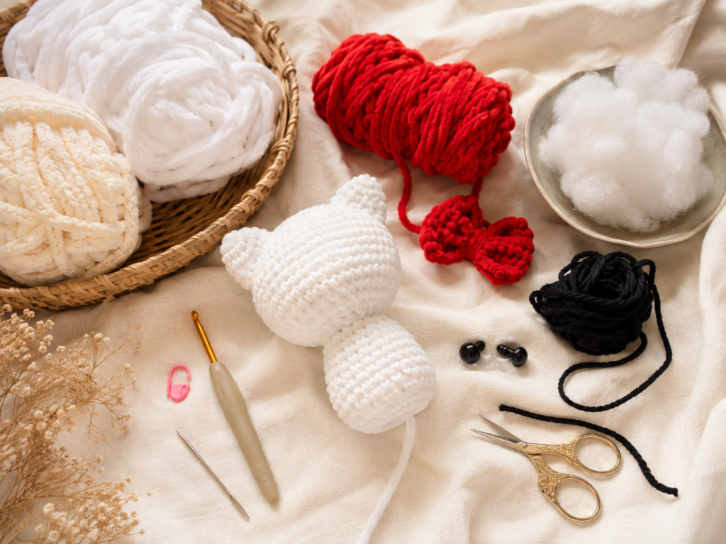 Yarn crochet hook stuffing and tools needed to make a crochet kitty plush