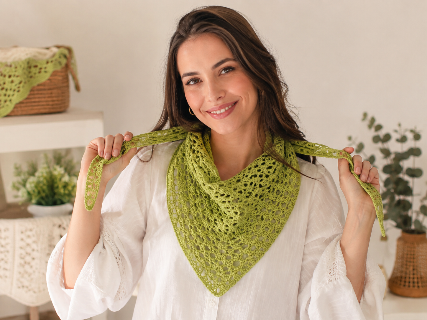 Woman wearing a handmade green crochet bandana with an openwork pattern