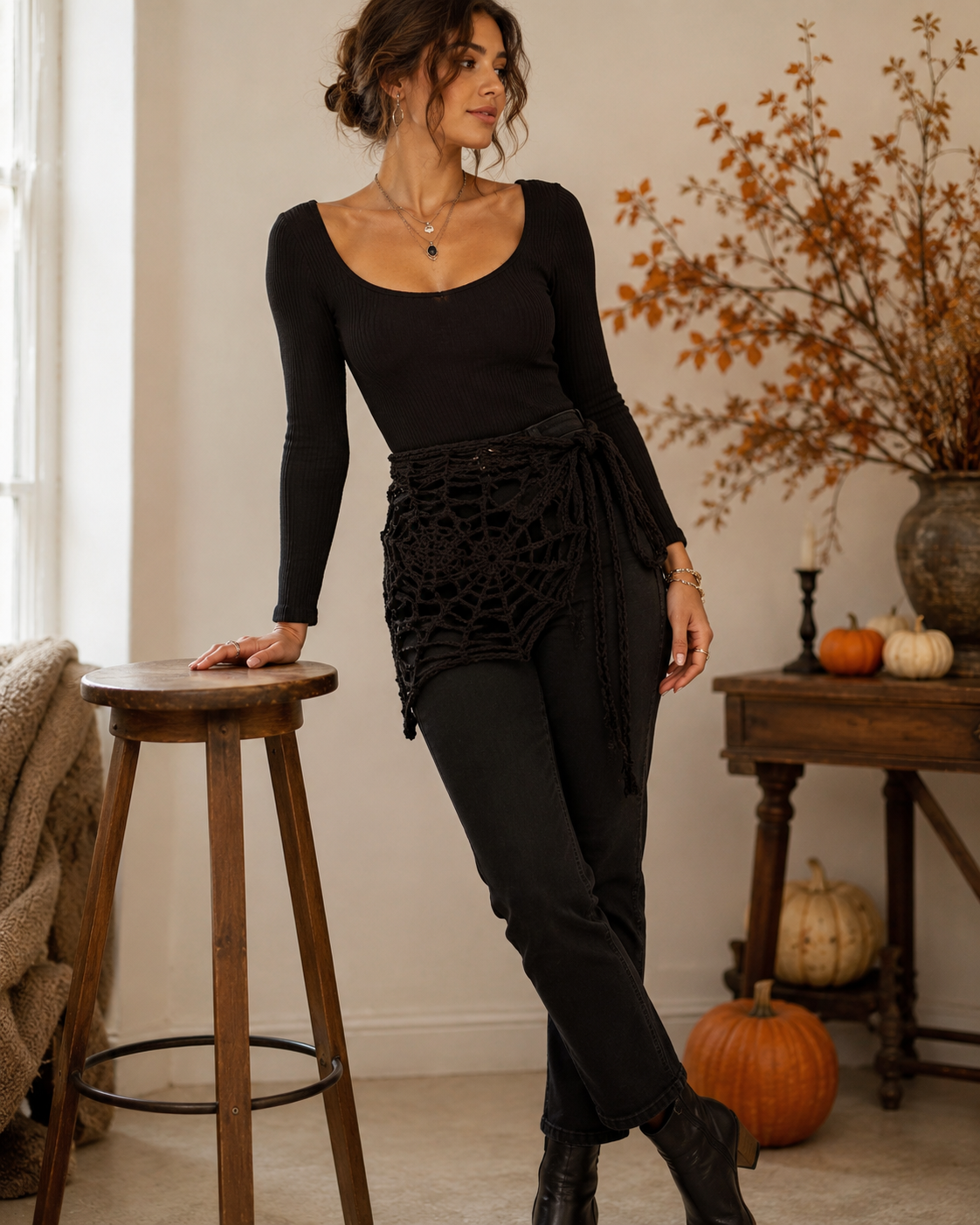 Black crochet spider web bandana styled around the waist with a Halloween outfit